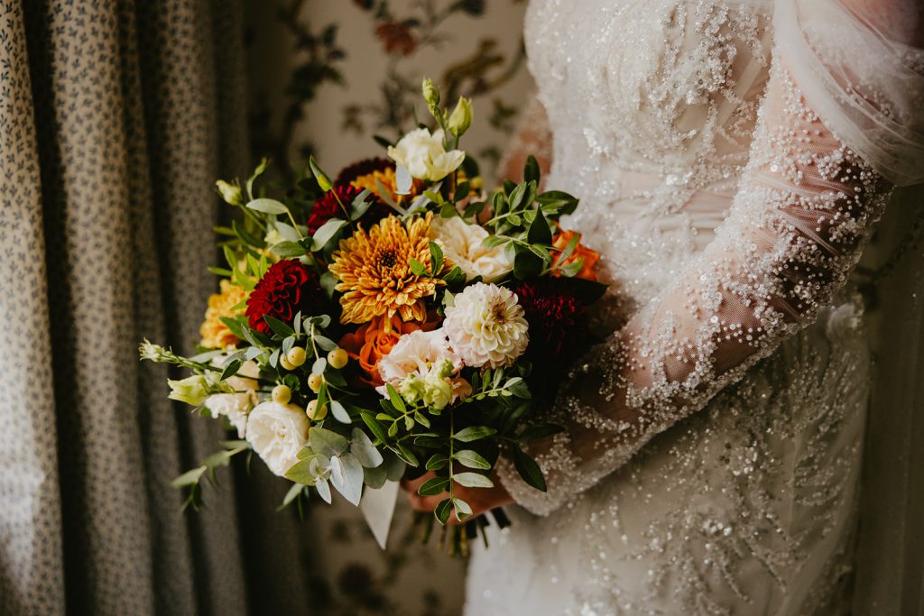 A beautiful bridal bouquet full of seasonal autumn flowers for a wedding at Healey Barn in Northumberland.